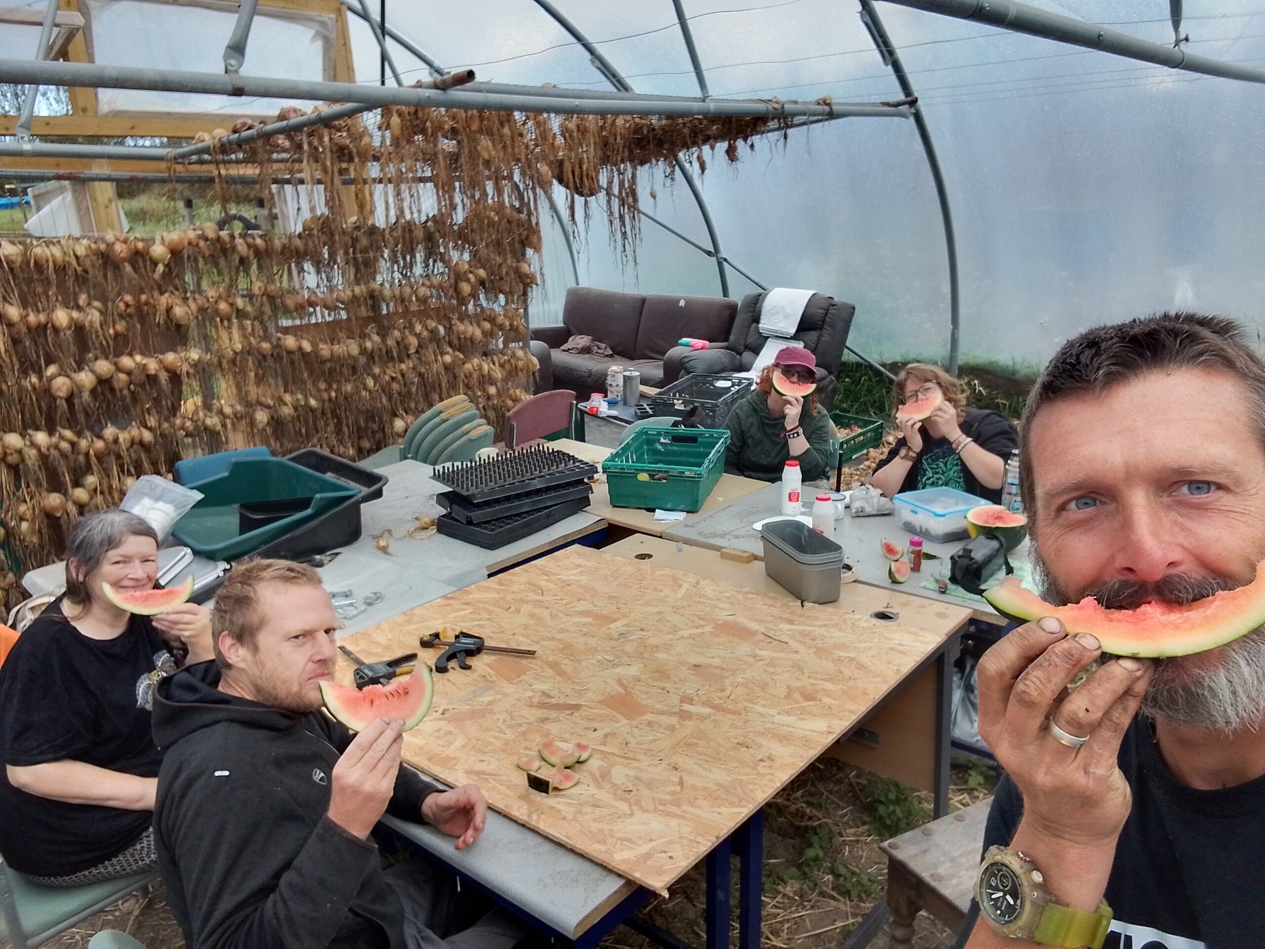 Volunteers sharing watermelon at Grassroots Garden